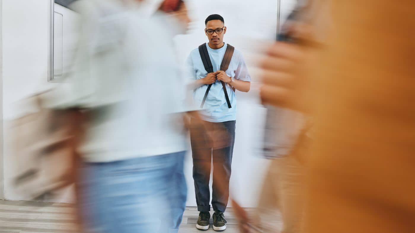 A person on a busy street, dealing with anxiety and depression symptoms