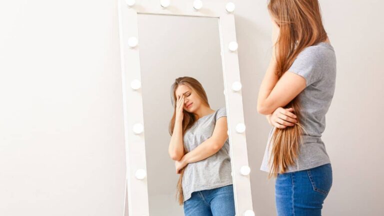 a Person in Front of a Mirror Feeling Unhappy Resiliency resiliency